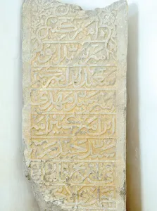 What is written on the tombstone in the mausoleum of Khoja Ahmad?